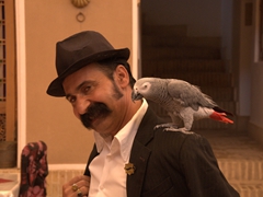 A performer and his parrot; old Yazd