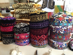 Colorful hats for sale at the Allaqulikhan Caravanserai