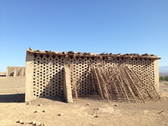 Mud built hut used to store grapes; near Jiaohe