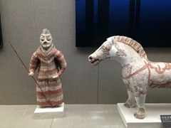 Painted clay figurines on display at the Turpan Museum