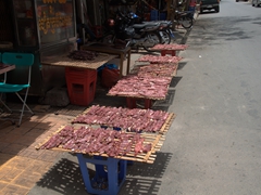 Homemade jerky - meat drying by the road side in Phnom Penh