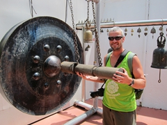 Robby striking a gong at Golden Mount