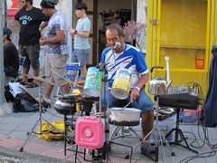 Street performer using recycled items