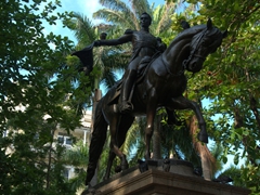 Statue of Simon Bolivar on horseback at the shady and pleasant Plaza de Bolivar