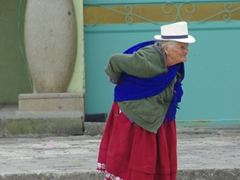 Indigenous woman crossing the Chordeleg square