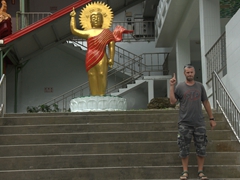 Robby mimics Buddha's pose at Changuana Temple in Taroko Gorge