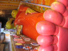 Large statue of reclining Buddha at Issurumuniyagala Monastery