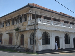 There is a large presence of Sri Lankan Moors (descended from the Arab merchants who settled in Galle) who live in Galle Fort area such as this man leaning against the doorway