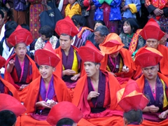 Monks performing in a ceremony; Day 5 of Paro Tsechu