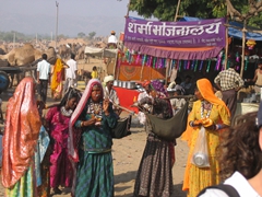 Rajasthani women slinging babies in make-shift carriers