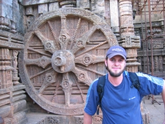 Robby posing in front of one of Konark Sun Temple's 24 wheels