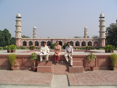 Wajid Ali, Becky, and Saeed posing in front of Jehangir's Tomb