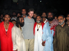 Robby posing with sweat-drenched sufis, Lahore's famous Thursday night "Spinning with the Sufis" spectacle