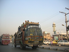 When the bus gets too full, passengers sit on top of the roof!