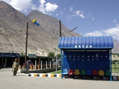NATCO bus stop with a "Welcome to Gilgit" stencil