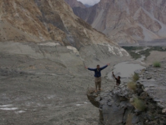 Robby and Zia are dare devils striking this crazy pose on the edge of this rocky outcrop; Passu