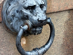 Lion detail at the base of a statue