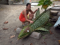 Becky is finally able to touch a "whale shark", albeit one made of palm leaves; Dhigurah Island