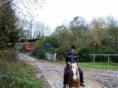Becky enjoys a horseback riding lesson courtesy of Nadine, our French/German neighbor