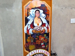 Store mural on side of wall; Castelsardo