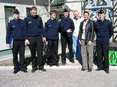 Becky poses for a group photo while on a Rescuer/Medcuer 2004 site survey at a Latvian military base