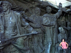 Becky is dwarfed by the sculptures of the memorial complex commemorating the German-Soviet War; National Museum of the History of the Great Patriotic War