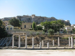 Ruined columns of the Roman Agora (acropolis in the background)