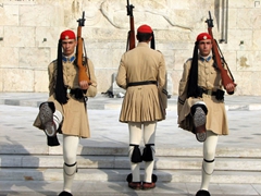 Evzone soldiers marching in step during a changing of the guards ceremony