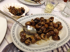 Enjoying the balsamic vinegar soaked grilled snails at our favorite restaurant in Heraklion, the excellent Ouzeri tou Terzaki