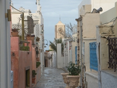 Empty Oia street after an early morning rain