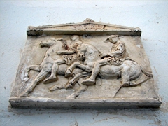 Detail of a plaque outside the entrance to a home in Hora