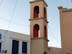 Bell tower of the colorful church in Hora