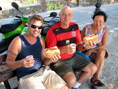 Robby, Bob, and Ann enjoy a picnic lunch under the shade at Aegiali's beach