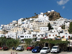 Ios is a gem of a Cycladic village with brilliant white washed homes clambering against the rocky hillside