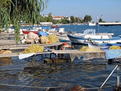 Fishing nets and boats line the waterfront