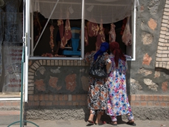 Ladies buying a slab of meat; Penjikent