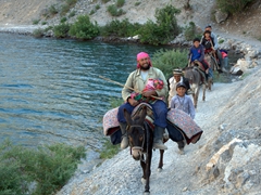 A Tajik family on a donkey caravan passes us on the narrow footpath of the 7th Lake (Hazor Chashma) of Marguzor