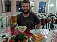 Robby enjoying a beer with his meal at Choikhona Rokhat