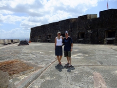 Striking a pose at the top level of La Fortaleza beside a pyramid of cannon balls
