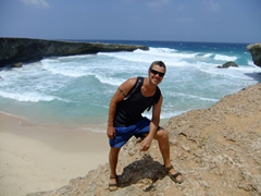 Robby strikes a silly pose next to this pristine Aruban beach