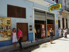 Becky posing outside Hemingway's favorite Havana mojito bar