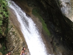 Becky enjoying the natural pool created by the waterfall at Topes de Collantes