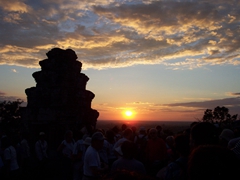 Sunset over Phnom Bakheng, a pyramid on top of a hill in Angkor (where you will compete with every other foreign tourist for a sunset view)