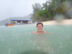 Becky finds it warmer to remain submerged in the sea than to get pelted with the cold monsoon rain; Pulau Beras Basah in Langkawi