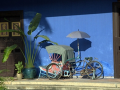 A rickshaw parked outside Cheong Fatt Tze Mansion; Penang
