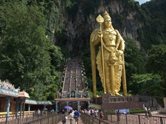 View of one of the most popular Hindu shrines outside of India, the famous Batu Caves. This is the entrance, dominated by a massive statue of Lord Murugan; Kuala Lumpur