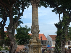 The Queen Victoria Fountain is smack dab in the middle of the Dutch Square, surrounded by red hued Dutch buildings; Malacca