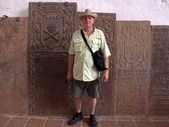 Bob stands next to old Portuguese tombstones in Saint Paul's Church; Malacca