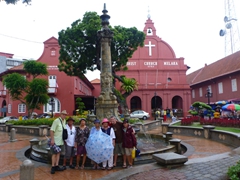 A slight downpour chased all the tourists away so we were finally able to take a group shot in the Dutch Square; Malacca