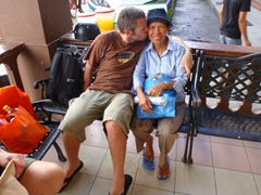 Robby plants a kiss on Di Phuong who has loaded up on Malacca souvenirs